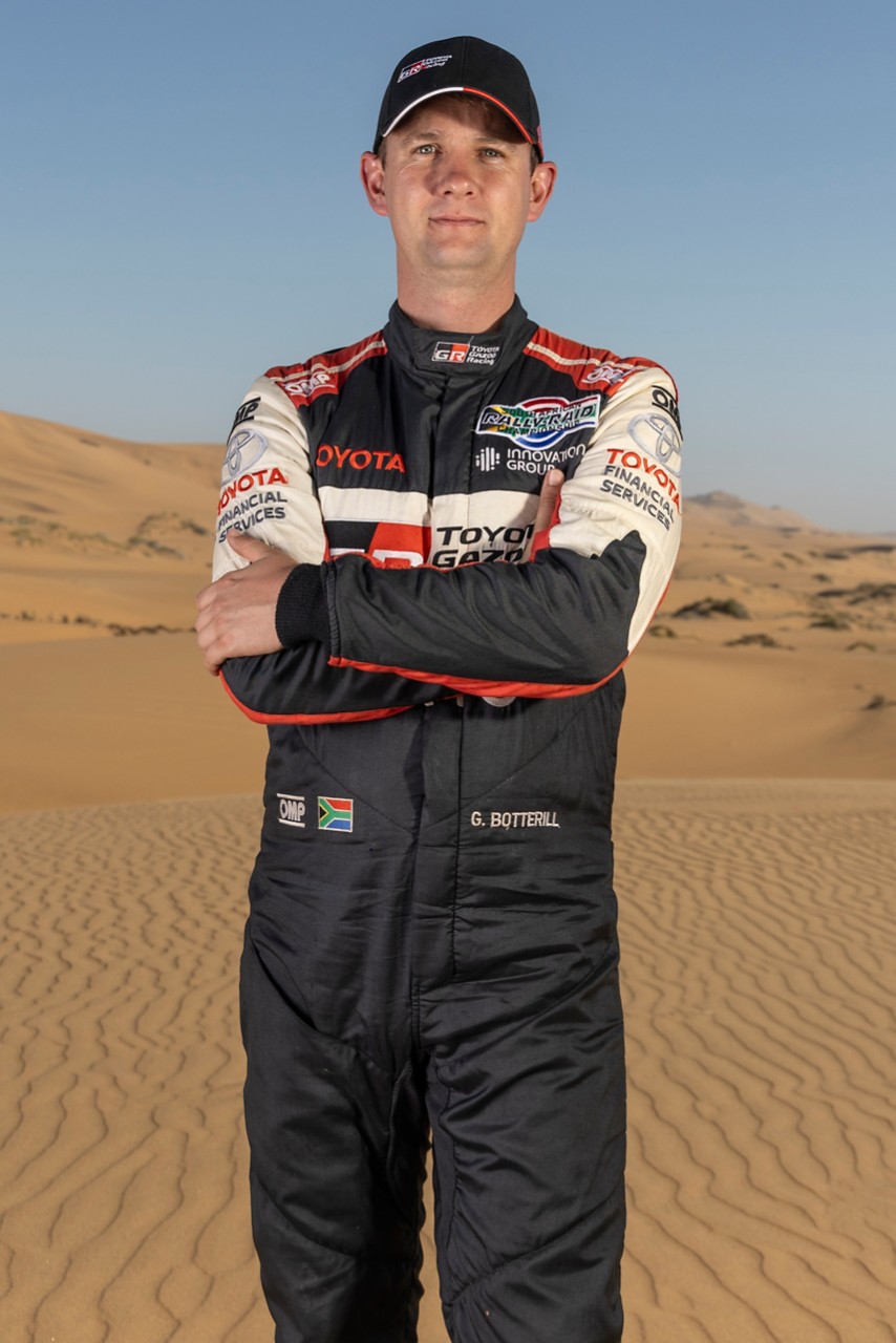 Team 3, Car 217 Driver Henk Lategan arms crossed smling to camera